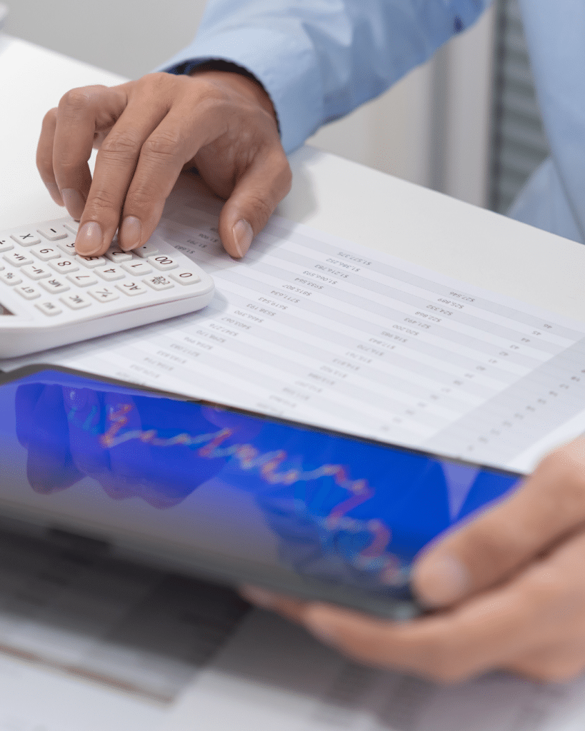 person holding a tablet with graph on it