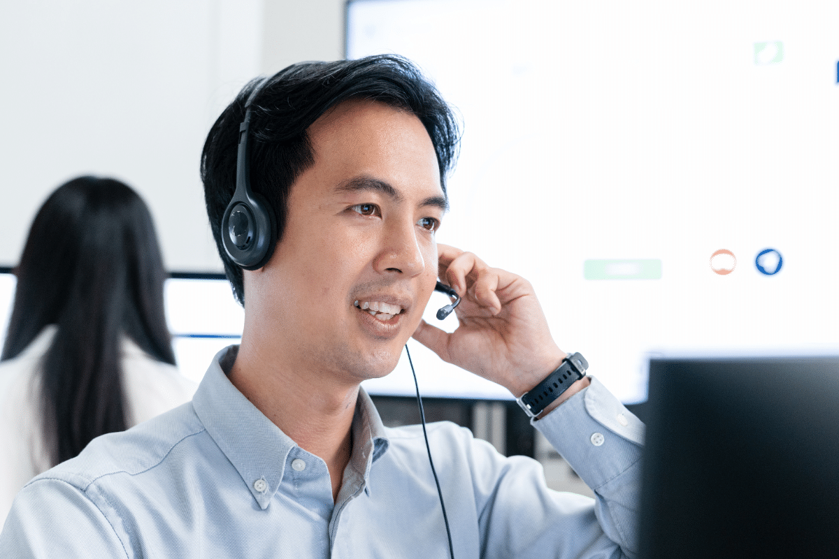 PCe Solutions Calgary IT helpdesk support technician wearing headset providing local managed IT assistance to Calgary businesses with fast response times