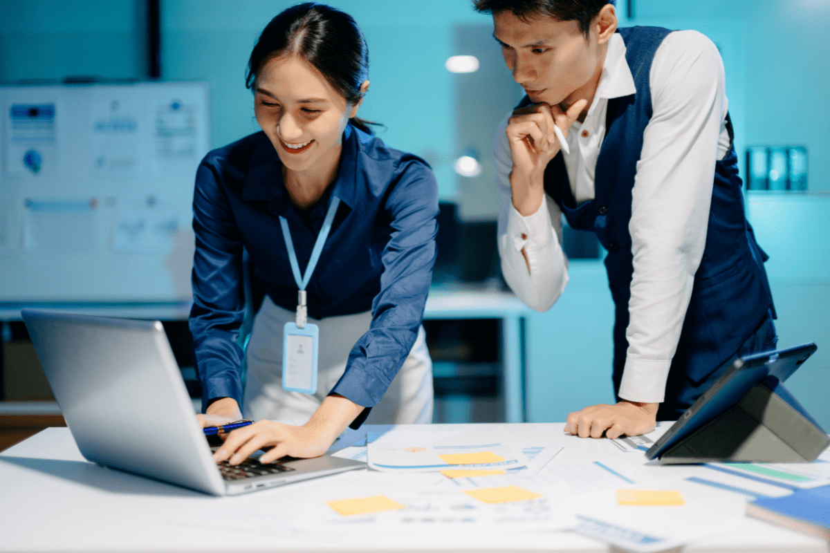 Calgary business professional reviewing AI-powered analytics dashboard representing PCe Solutions Managed Intelligence AI services for Calgary Alberta businesses across energy, financial, healthcare and engineering sectors